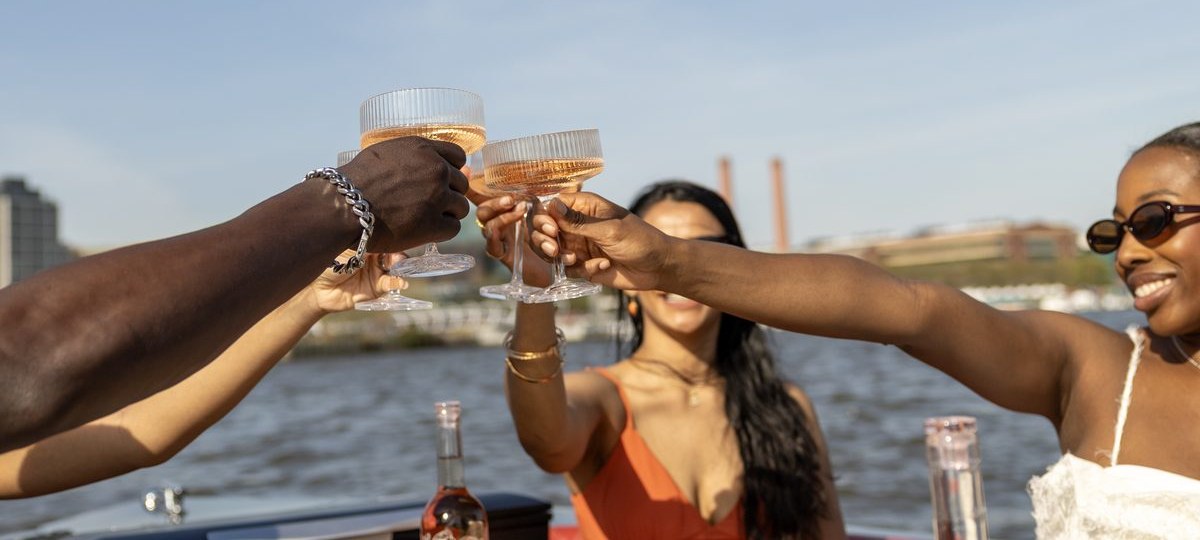 Friends toasting on a DC birthday cruise