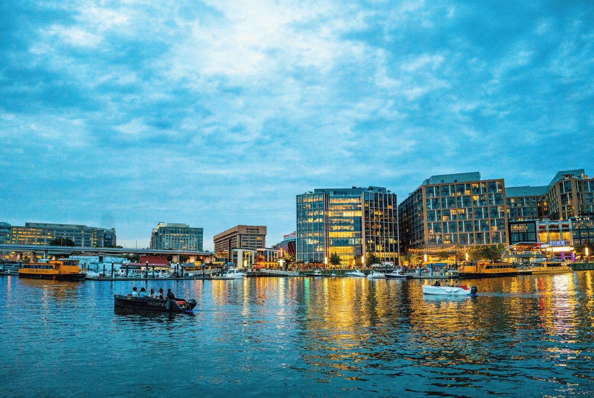 Washington DC skyline glowing at dusk, the view from aboard a Yachtsy private picnic boat